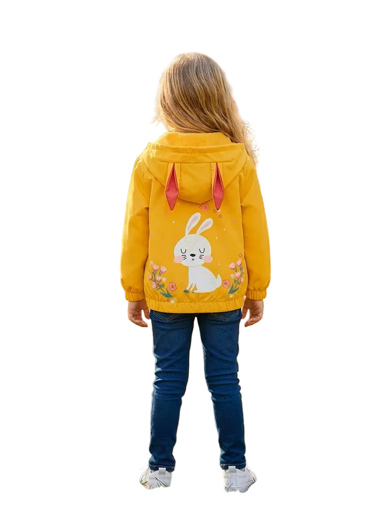 Child wearing a yellow hoodie with a rabbit design on a white background