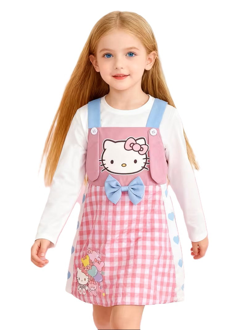 Child wearing a Hello Kitty dress with a white background