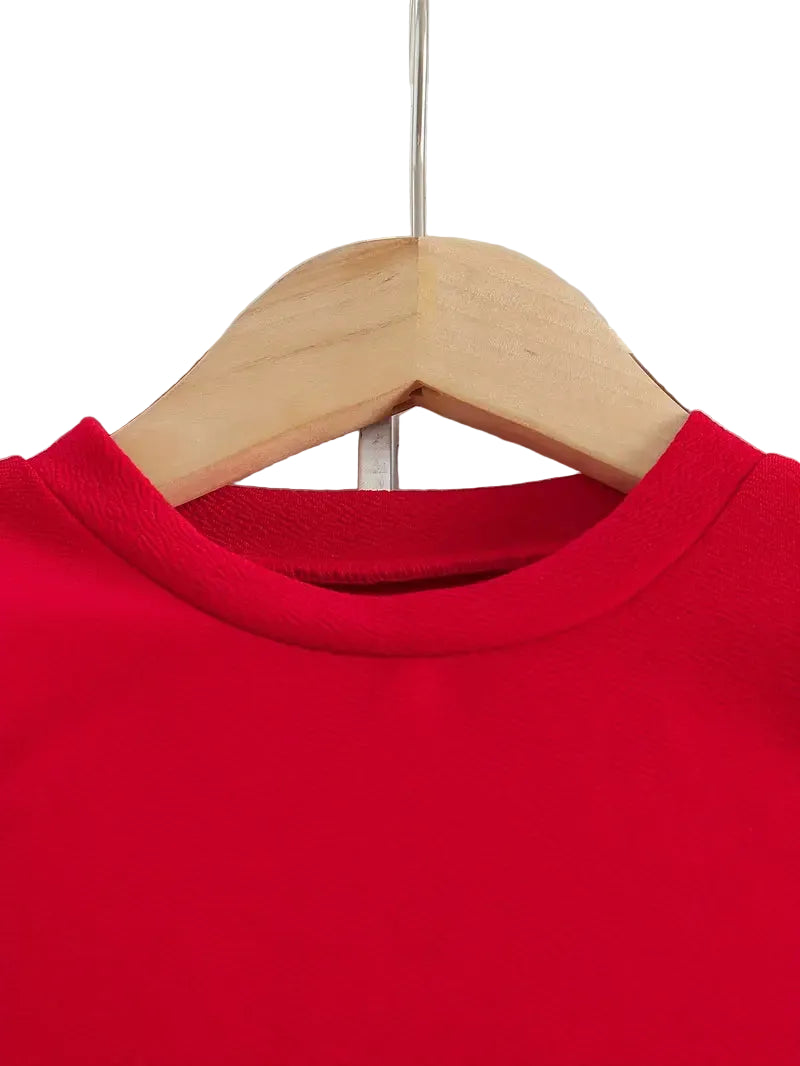 Red sweatshirt on a wooden hanger against a white background