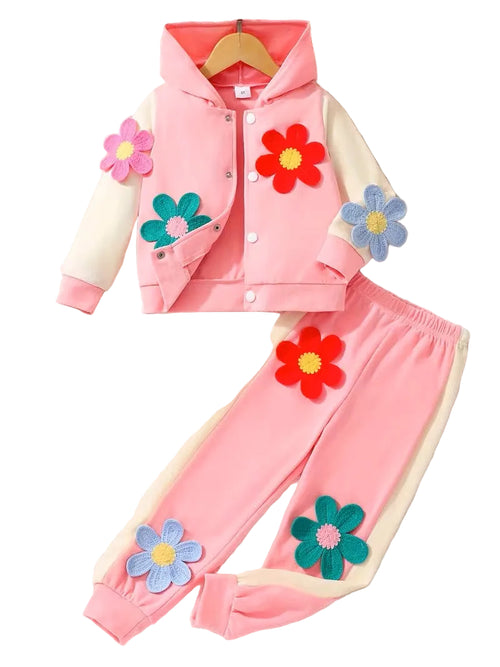 Children's pink outfit with floral designs on a white background