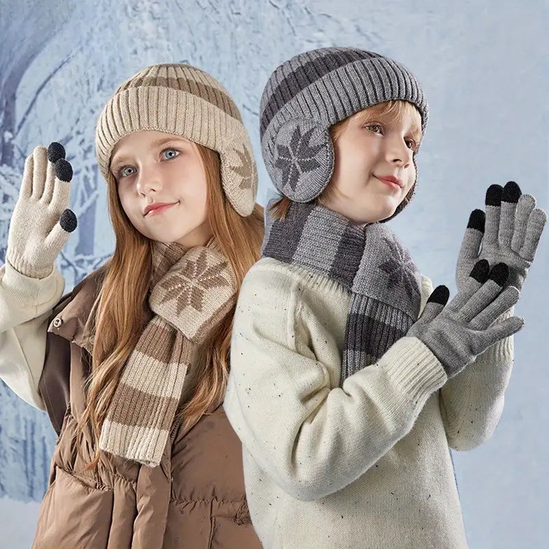 Two children wearing winter hats, scarves, and gloves against a snowy background.
