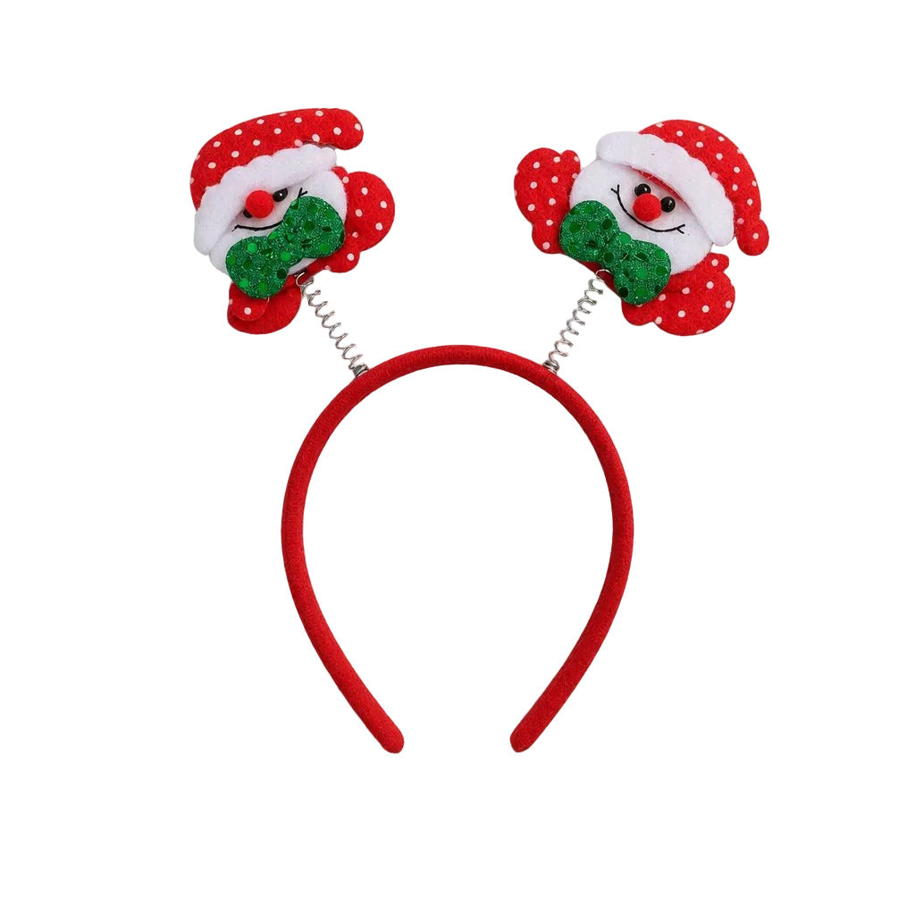 Red headband with two snowman figures with green glitter bow ties