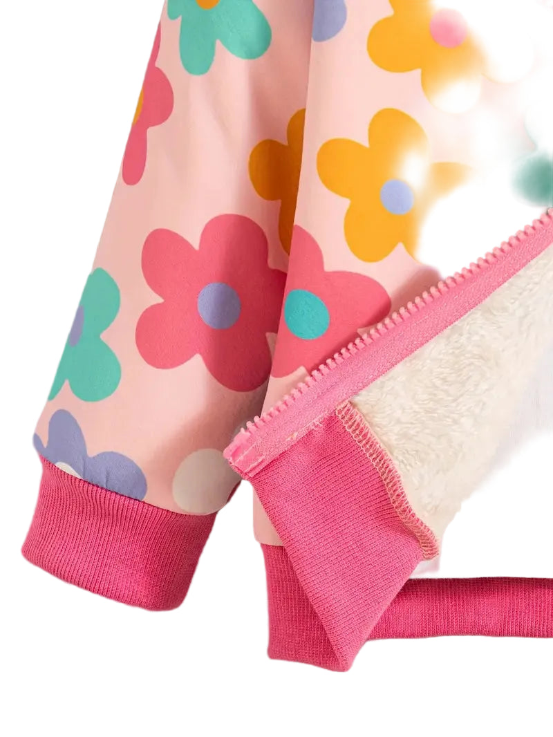 Children's clothing with colorful flower patterns on a pink background
