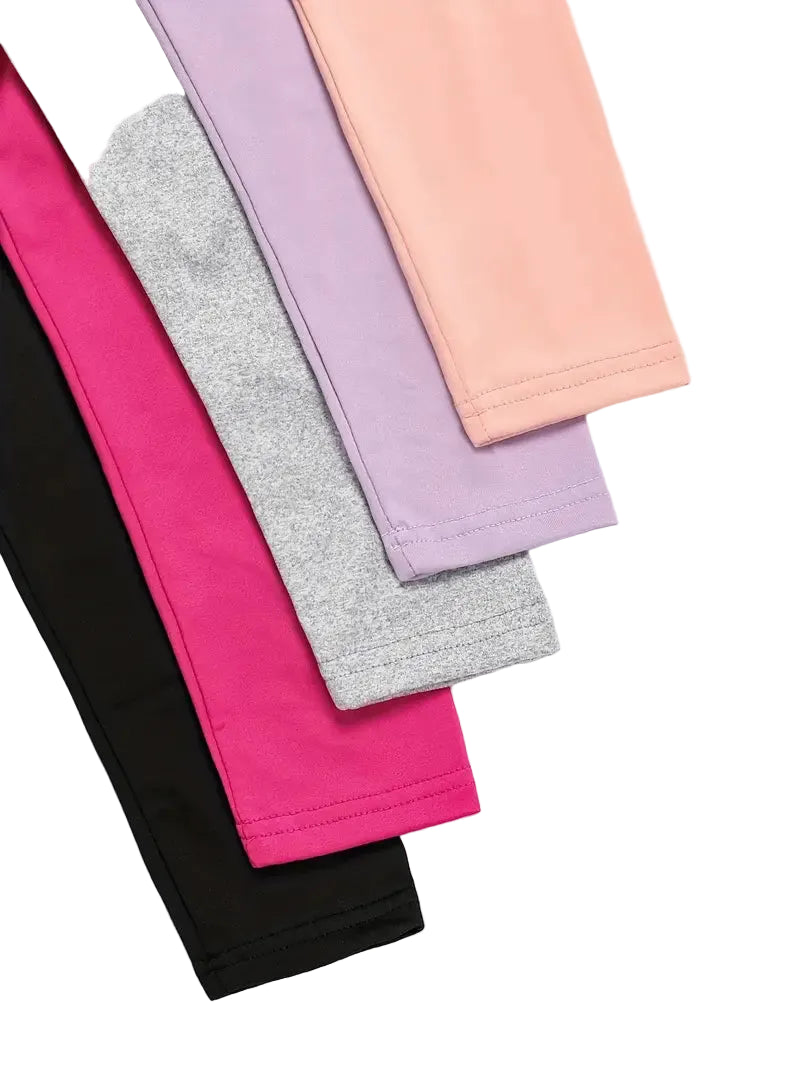 Stack of colorful leggings on a white background