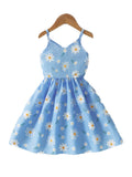 Blue dress with floral pattern on a hanger against a white background