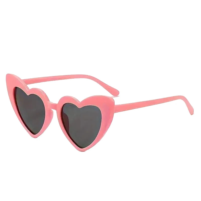 Pink heart-shaped sunglasses in a gift box.