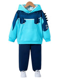 Children's blue hoodie and navy pants set with dinosaur design on a white background