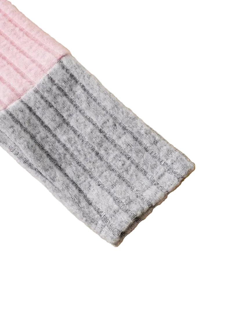 Gray and pink fabric swatch on a white background