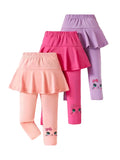 Three pairs of children's leggings with skirts in pink, purple, and peach on a white background.Skirted Leggings with Cute Cat for Playful Outfits