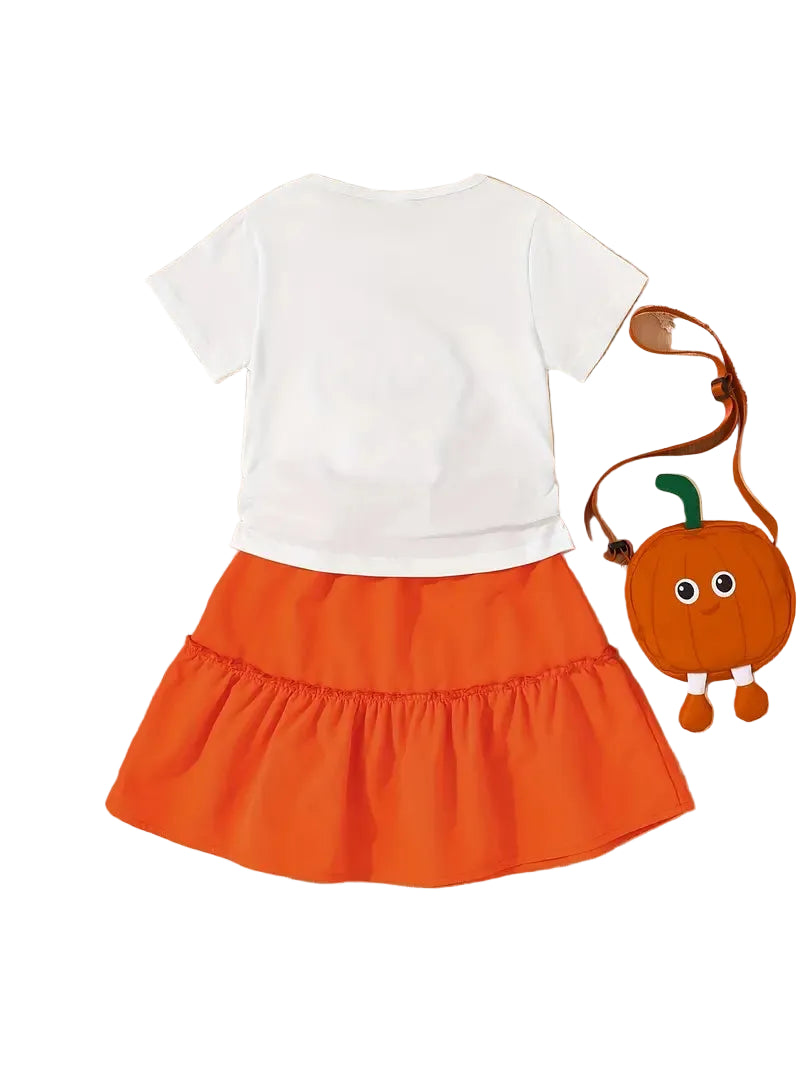 White shirt and orange skirt with a small pumpkin bag on a white background