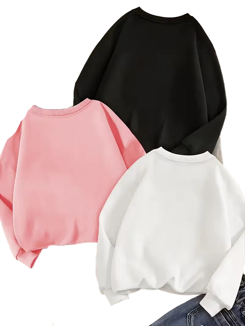 Three sweatshirts in black, pink, and white on a white background