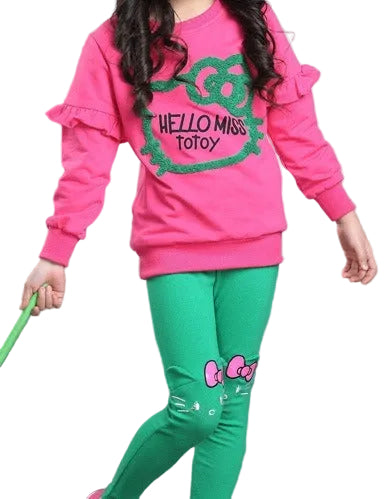 Child wearing a pink sweatshirt and green pants with 'Hello Miss Totoy' branding.