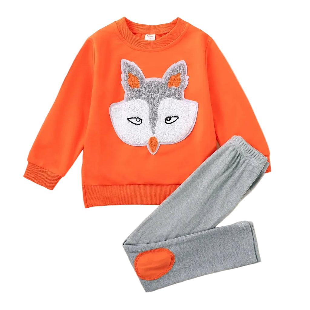 Orange sweatshirt with fox design and gray pants on a white background