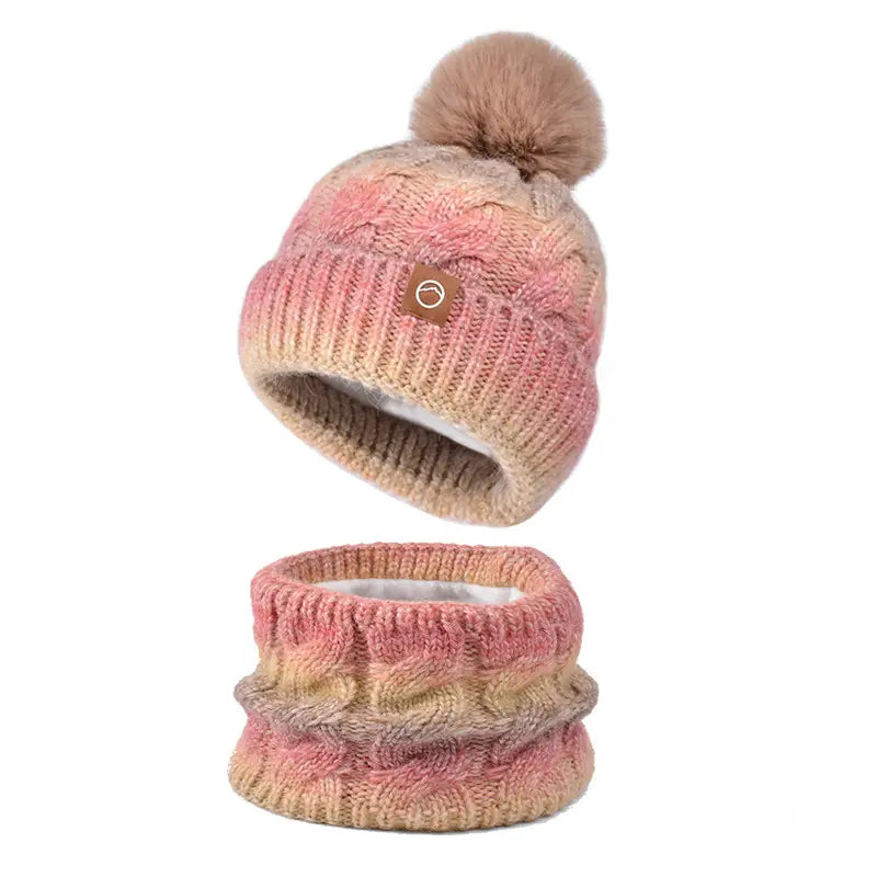 Knitted hat and scarf set with pom-pom on a white background
