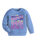 Blue sweatshirt with 'Home is where Mom is' text on a textured surface with shoes and sunglasses.