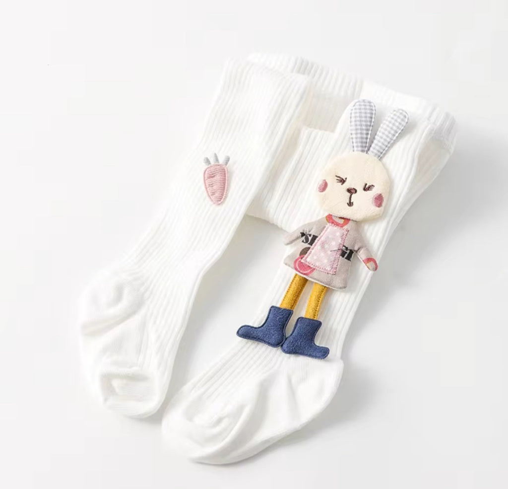 Assorted children's tights with cartoon bunny patterns in various colors.