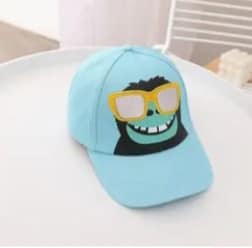 Light blue cap with a cartoon character design on a white surface
