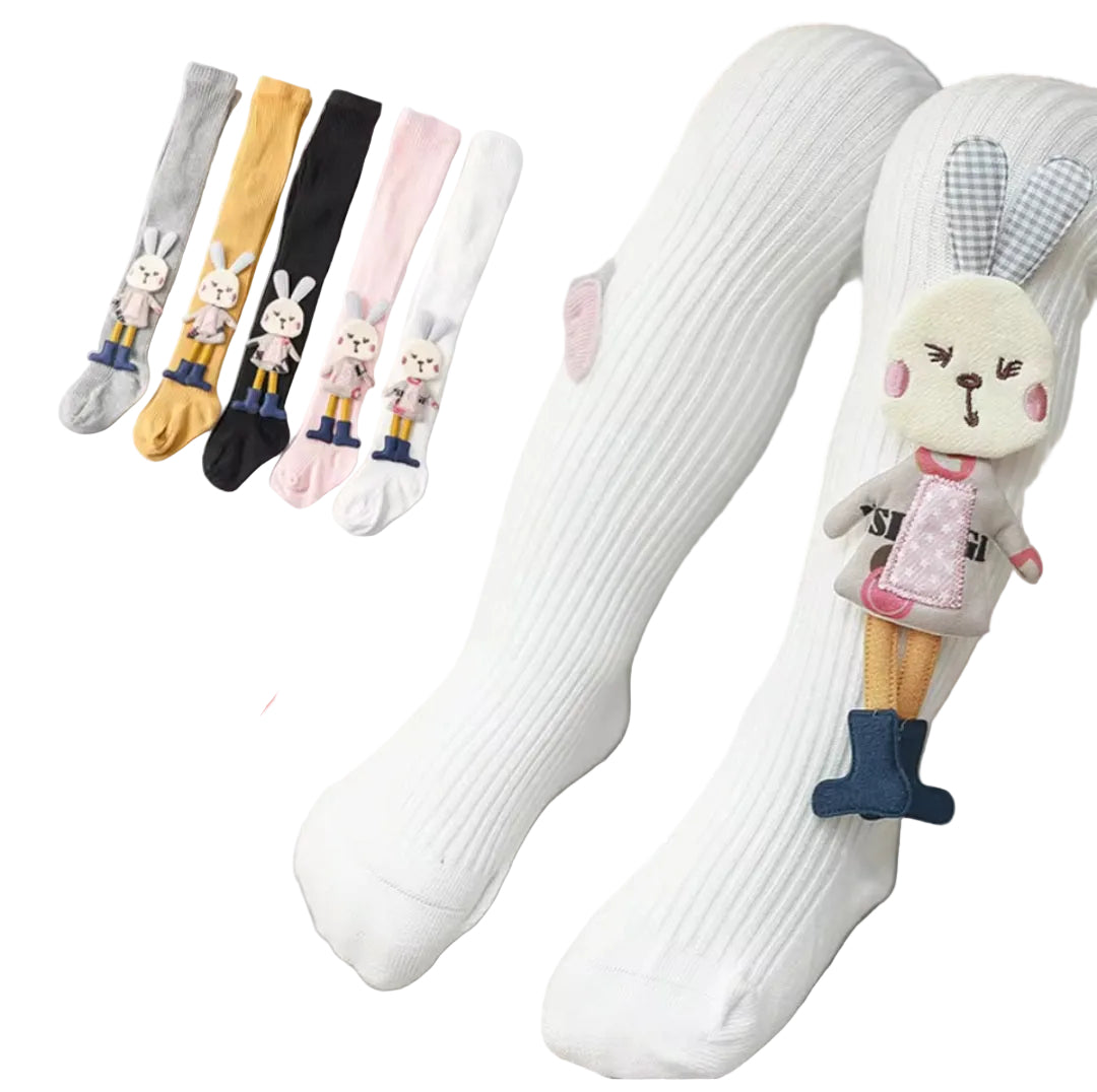 White knee-high socks with cartoon character decorations on a gray surface.