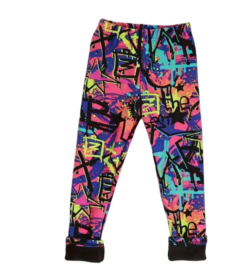 Colorful graffiti-patterned pants on a white background