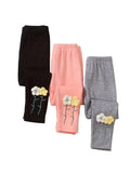 Three pairs of leggings in black, pink, and gray with floral designs on a white background.