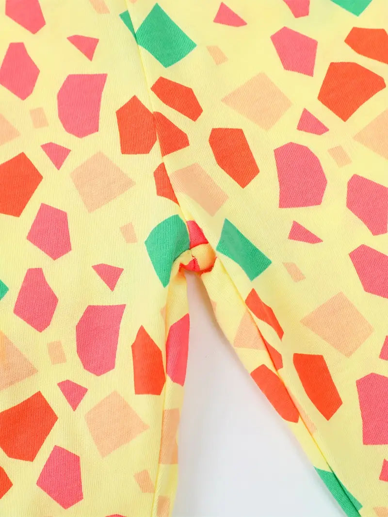 Colorful geometric patterned fabric on a yellow background