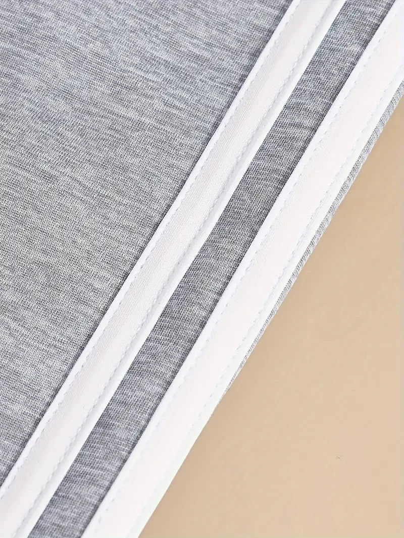 Close-up of gray, white, and beige fabric swatches