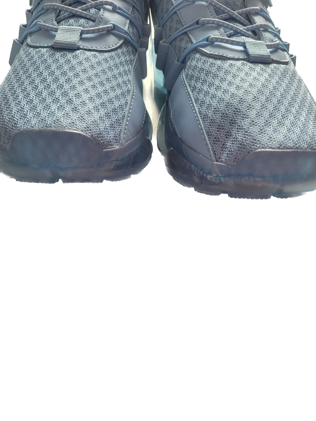 Pair of blue athletic shoes on a white background
