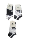 Three pairs of black and white socks with Chanel branding on a white background