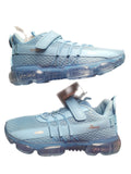 Light blue sneakers with transparent sole on a white background