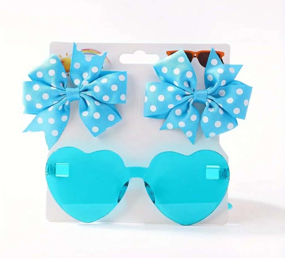 Blue heart-shaped sunglasses with matching blue polka dot bows on a white background
