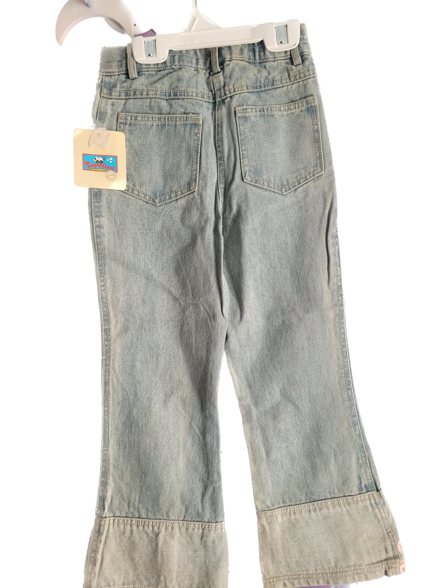 Light blue jeans with a tag on a white background