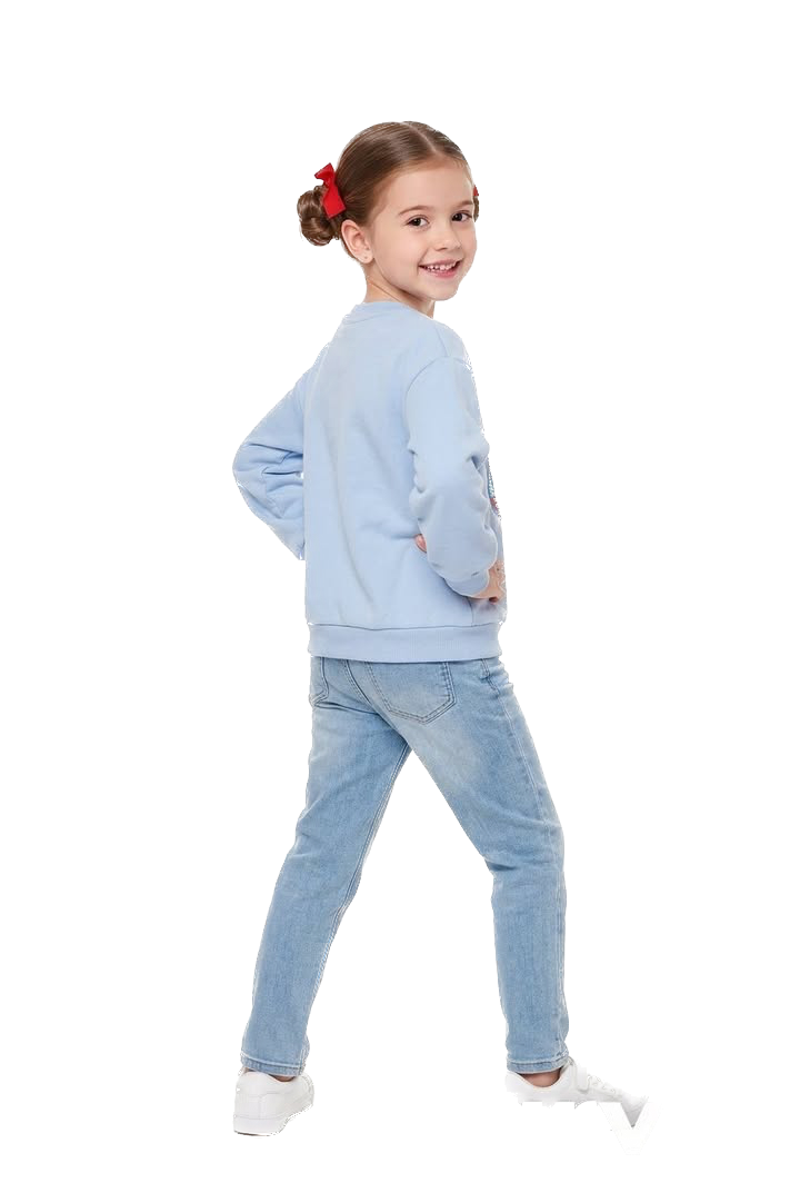 Young girl wearing a light blue sweatshirt and jeans on a white background