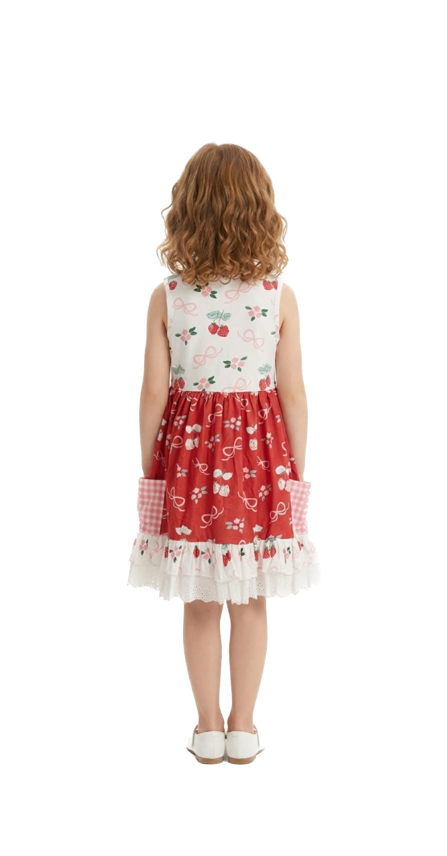 Young girl wearing a red floral dress on a white background
