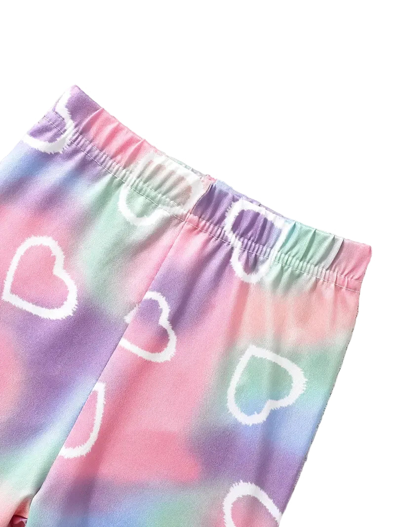 Colorful tie-dye shorts with heart patterns on a white background