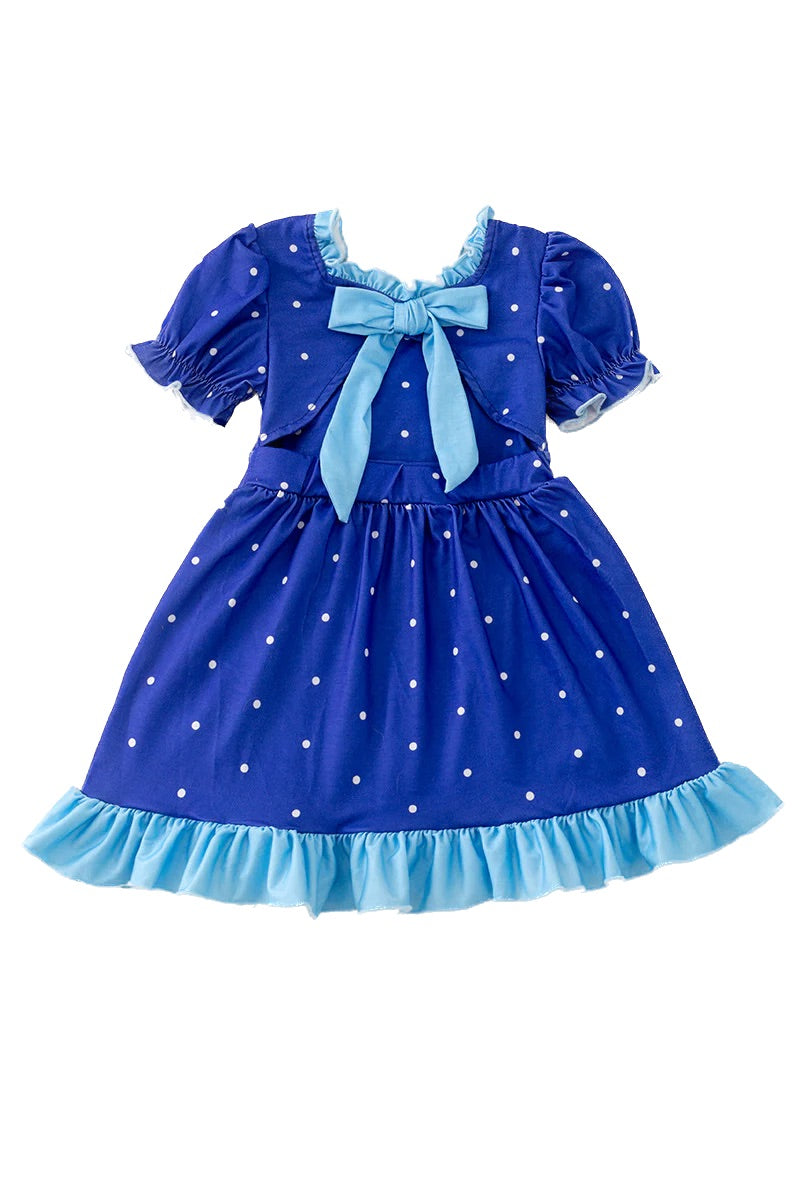 Blue dress with white polka dots and a large bow