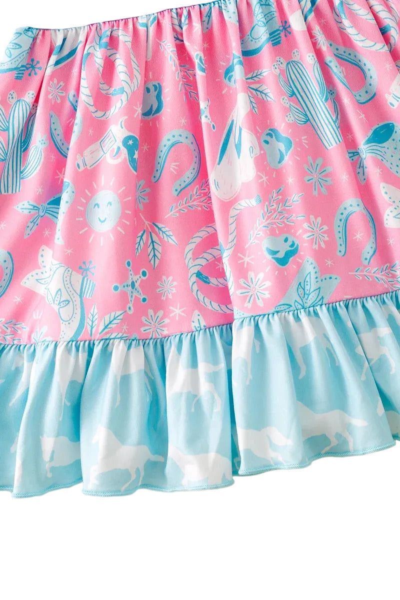 Pink skirt with blue patterns on a light wooden surface