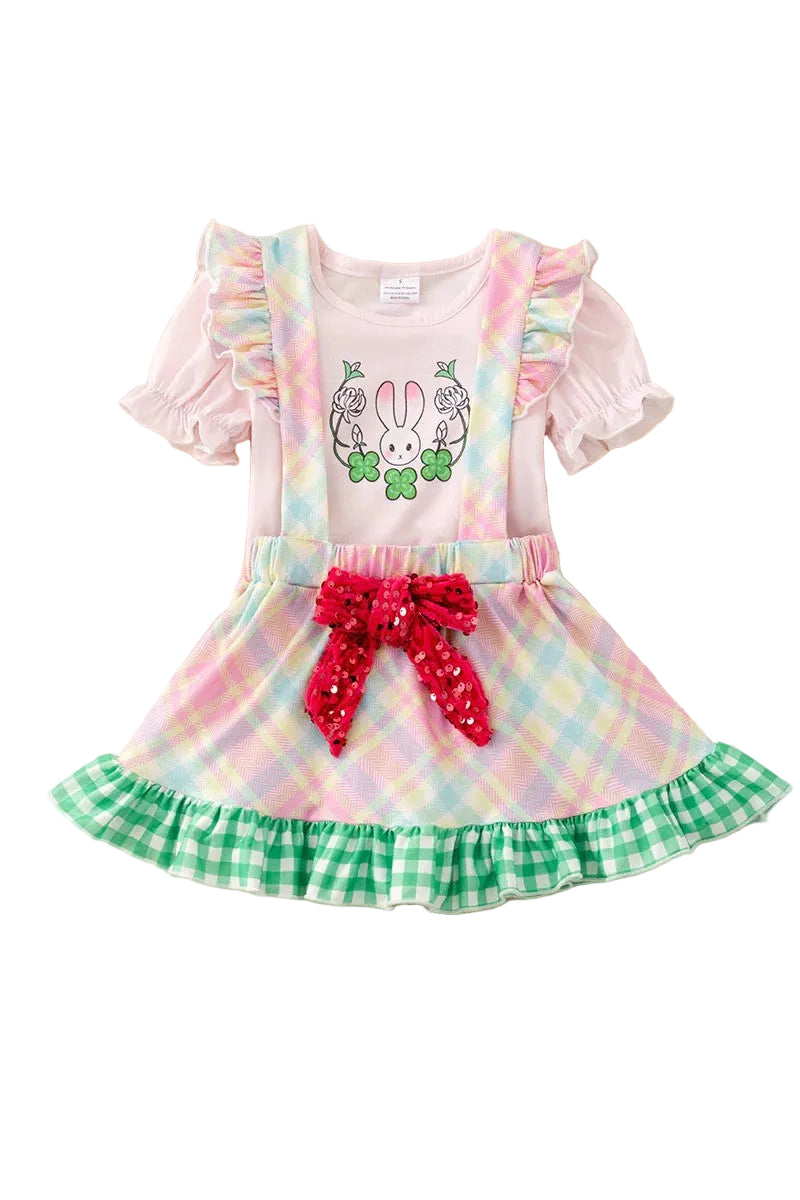Colorful dress with a bow and bunny design on a white background