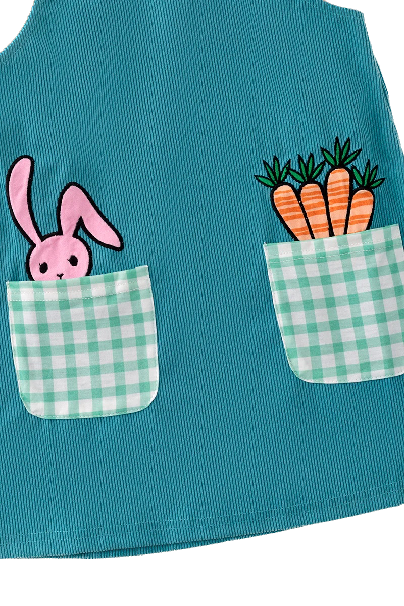 Teal apron with cartoon bunny and carrots design on a white background