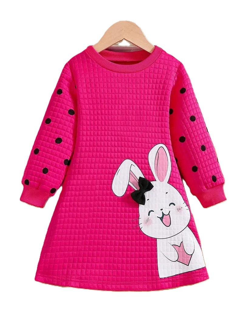Pink dress with black polka dots and a bunny design on a hanger against a white background