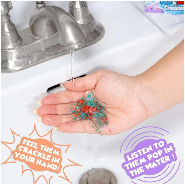Hand holding colorful beads over a sink with text about them crackling and popping in water.