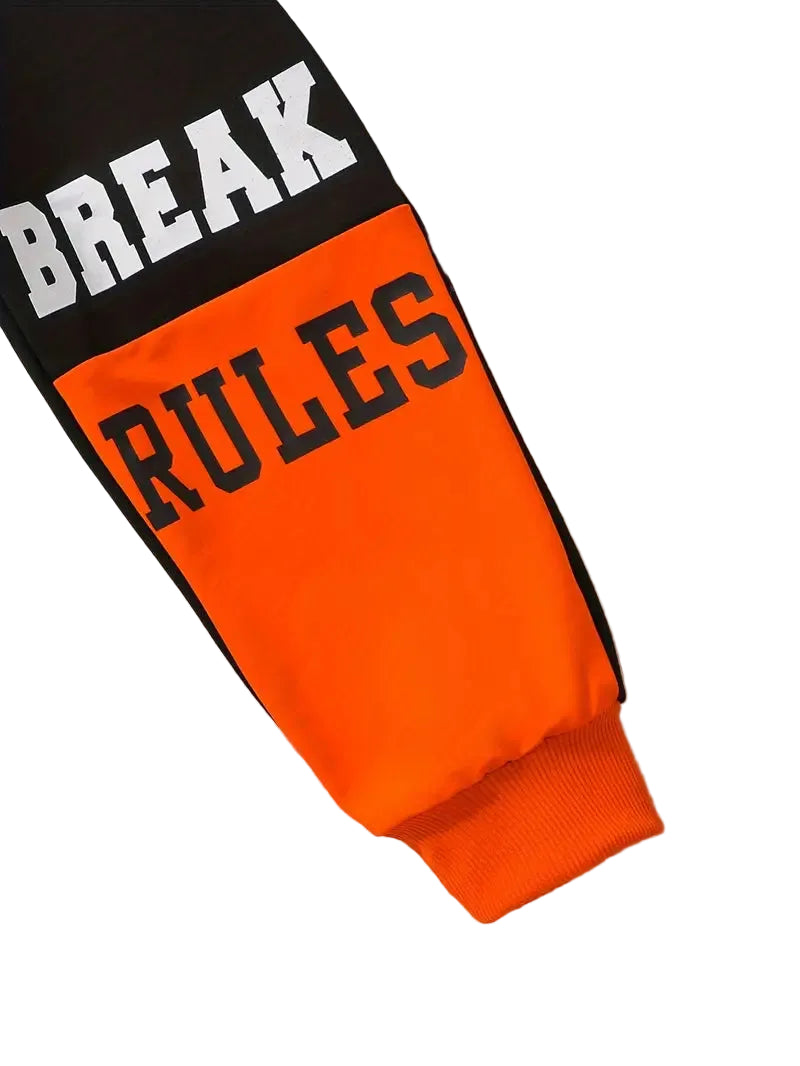 Orange and black leg warmer with 'BREAK RULES' text on a white background