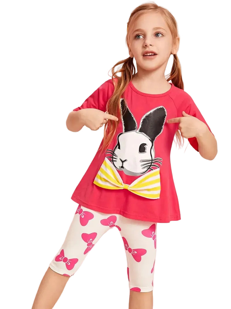Young girl wearing a red shirt with a bunny design and white leggings with pink butterfly patterns.