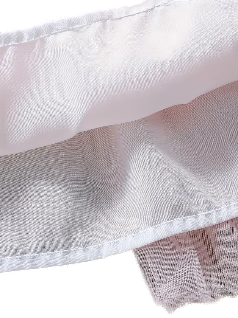 Close-up of a white pillowcase with a pink interior on a white background