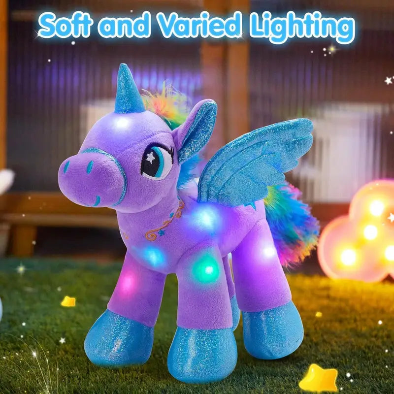 Plush toy unicorn with LED lights on a grassy area with soft lighting