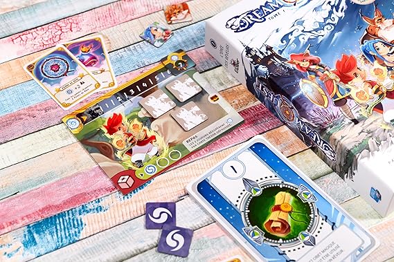 Board game components including cards and a box on a wooden surface