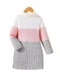 Color-blocked sweater with pink, white, and gray sections on a hanger against a white background