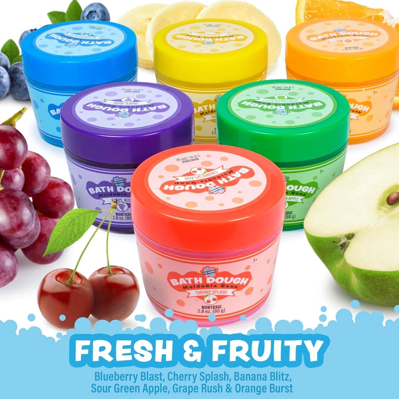 Colorful jars of bath dough with fruit-themed labels on a white background