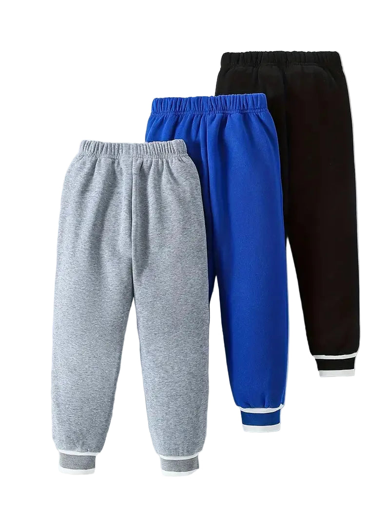Three pairs of sweatpants in gray, blue, and black on a white background.