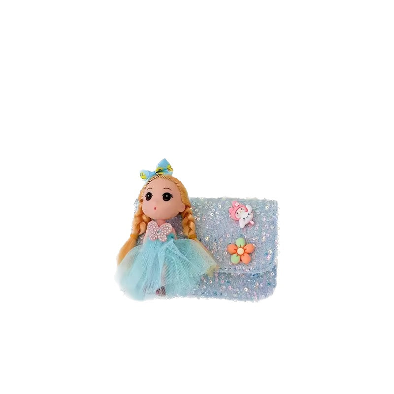 Plush doll with blue dress and blonde hair on a white background