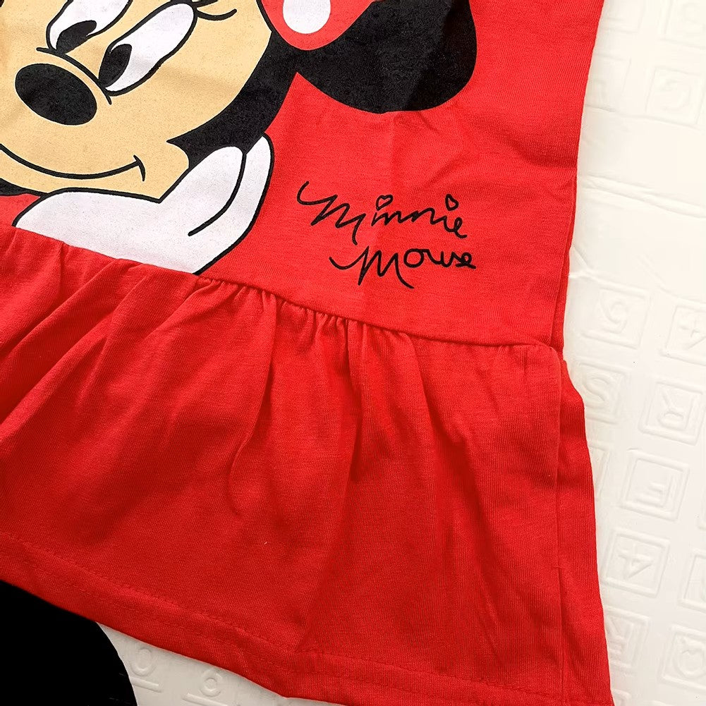 Red dress with Minnie Mouse face and signature on a textured surface